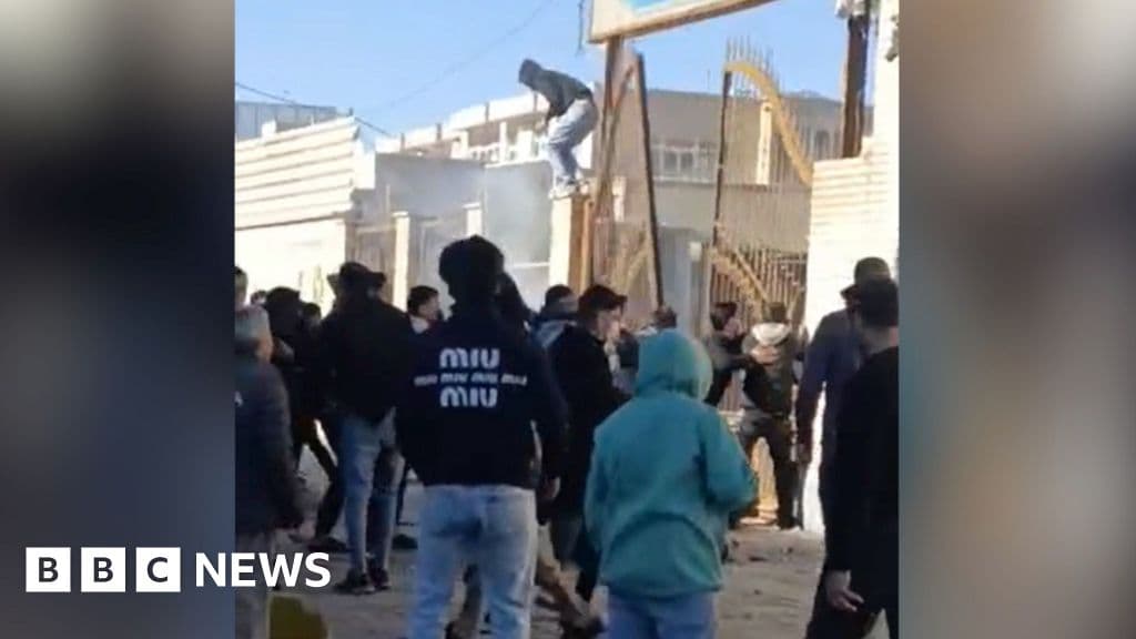 Iran security force member killed during protests, officials say - BBC