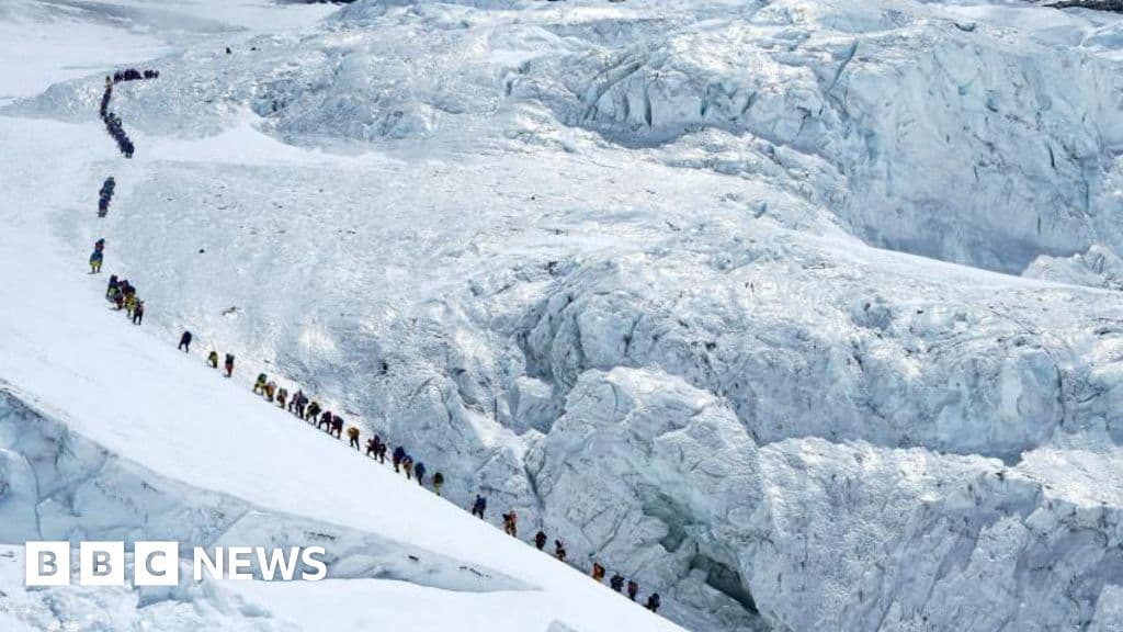 Record 274 climbers scale Everest via Nepal in one day - BBC